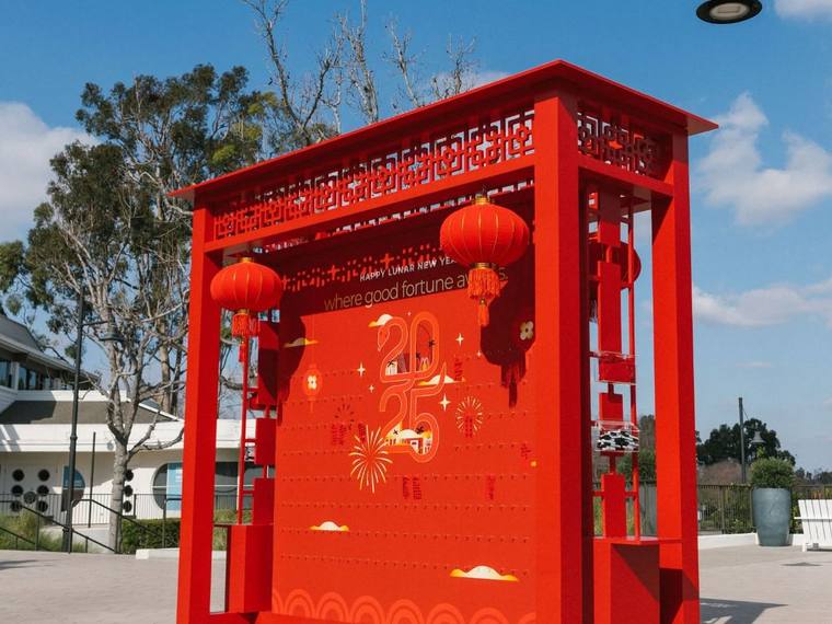 A red custom-built photo structure with hanging lanterns.
